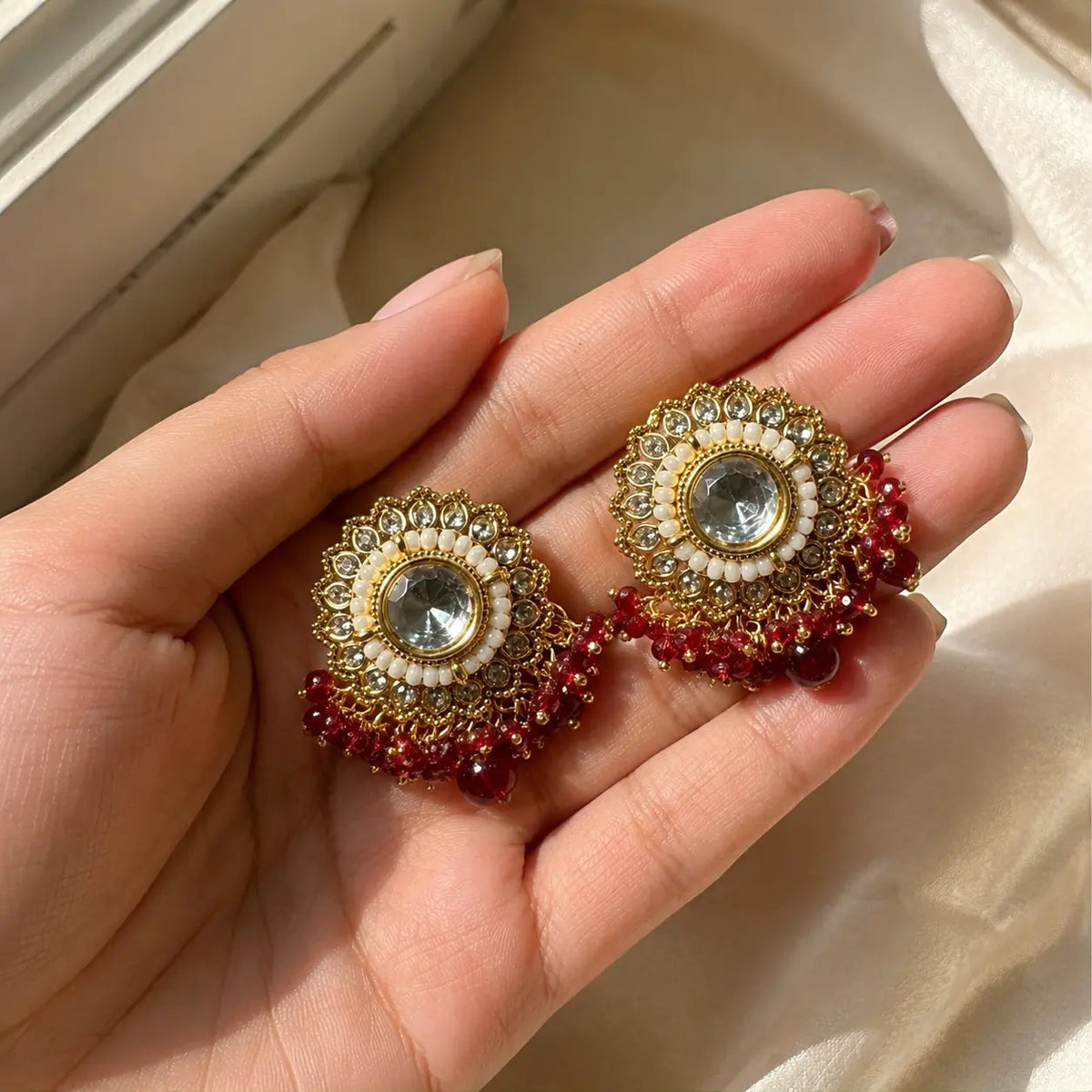 Noorani Red earrings handheld scale view