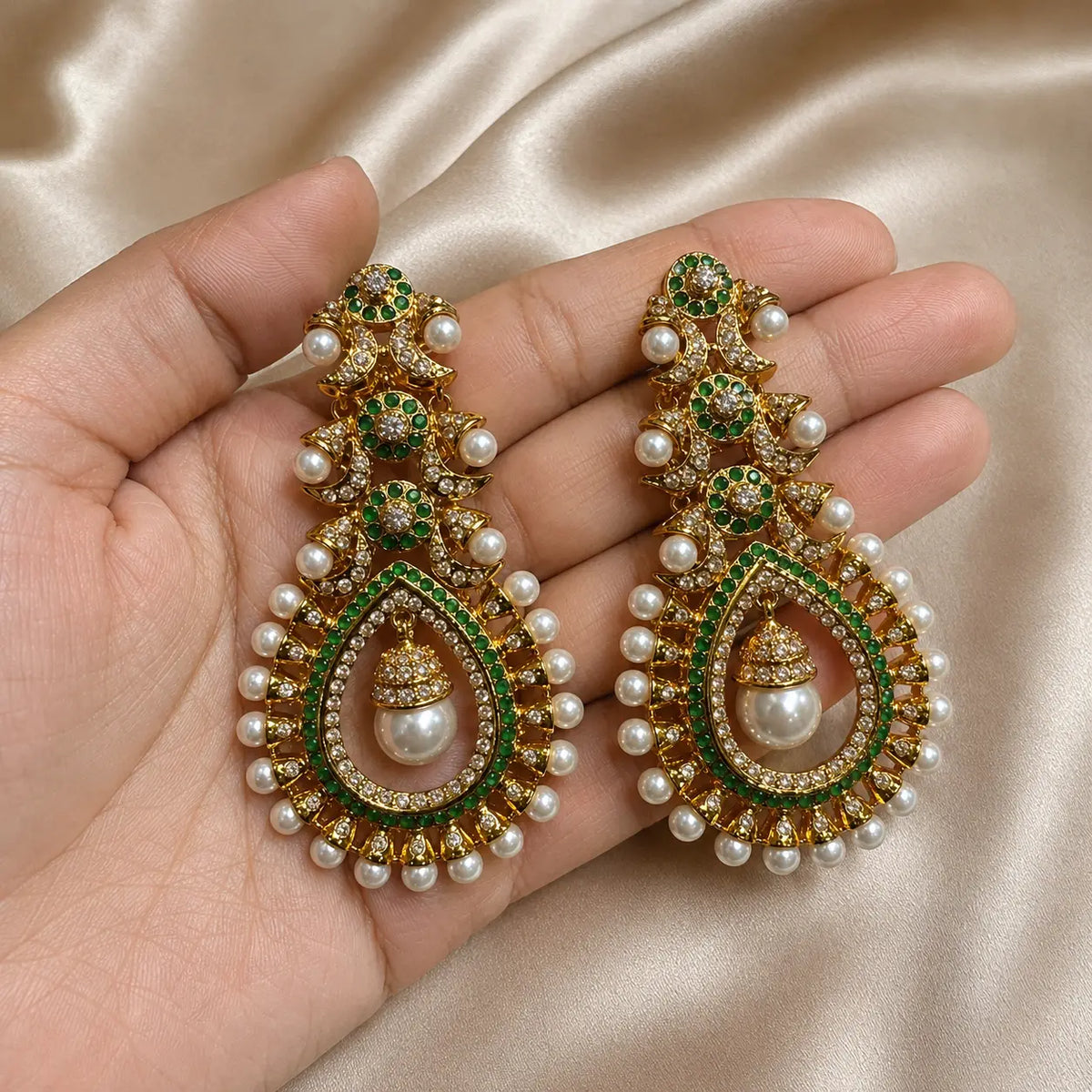 Mehrunisa Kundan Pearl Drop Statement Earrings - green handheld