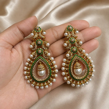 Mehrunisa Kundan Pearl Drop Statement Earrings - green handheld