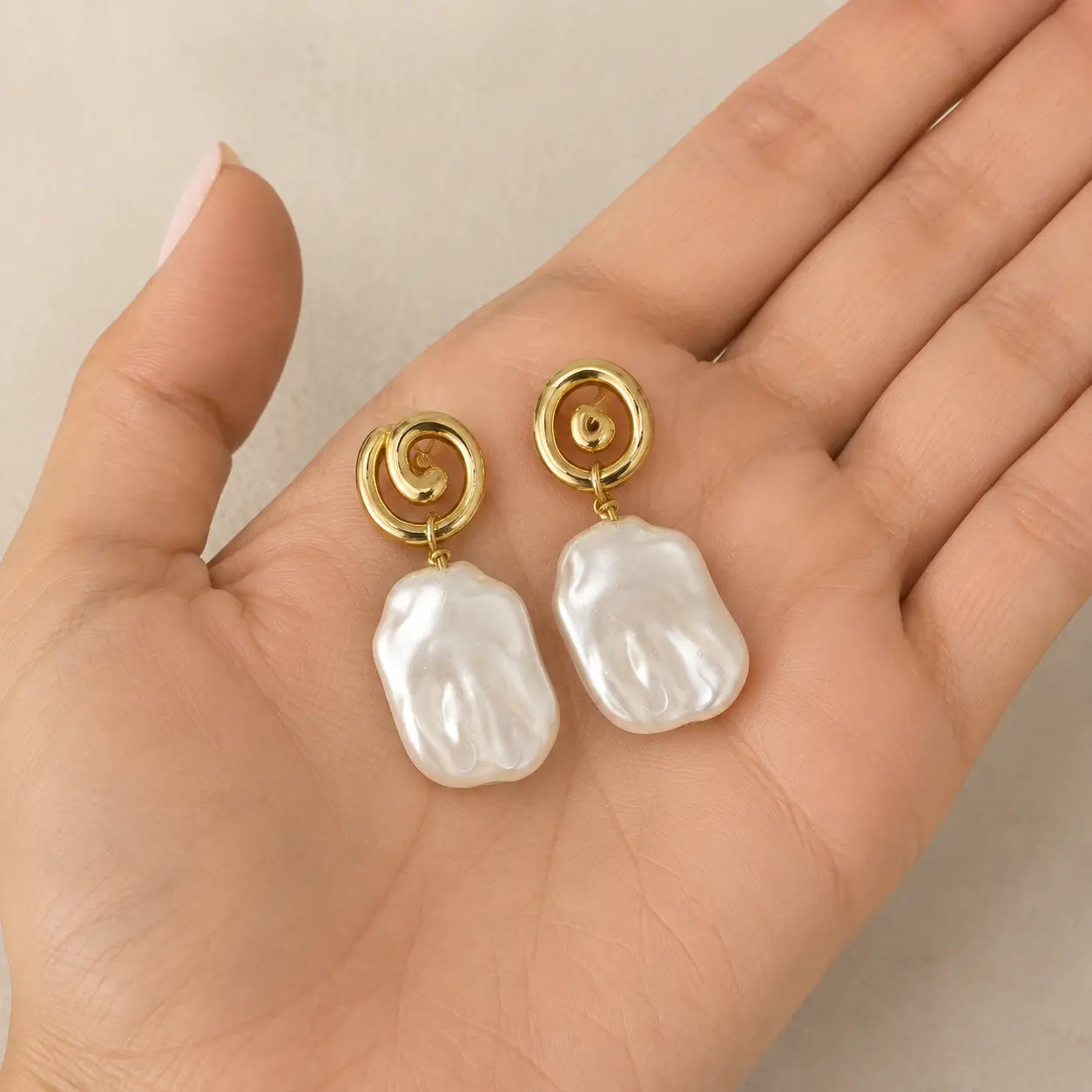Sadaf baroque pearl earrings handheld view
