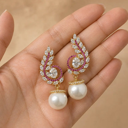 Meher Ruby paisley pearl earrings handheld view