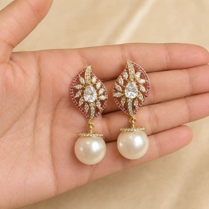 Noor Ruby crystal leaf pearl earrings handheld view