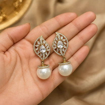 Noor White crystal leaf pearl earrings handheld view