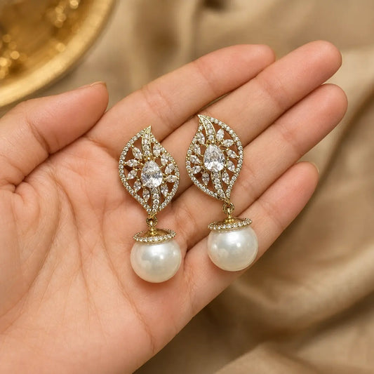 Noor White crystal leaf pearl earrings handheld view