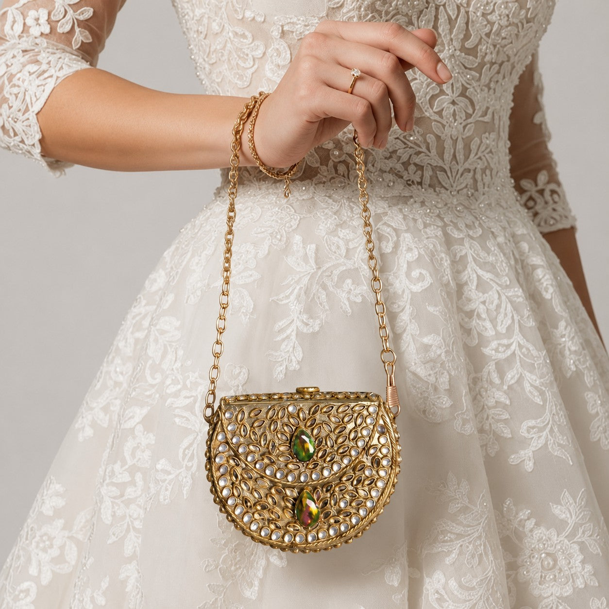 Gold Kundan Pearl Half Moon Bag with Emerald Gem