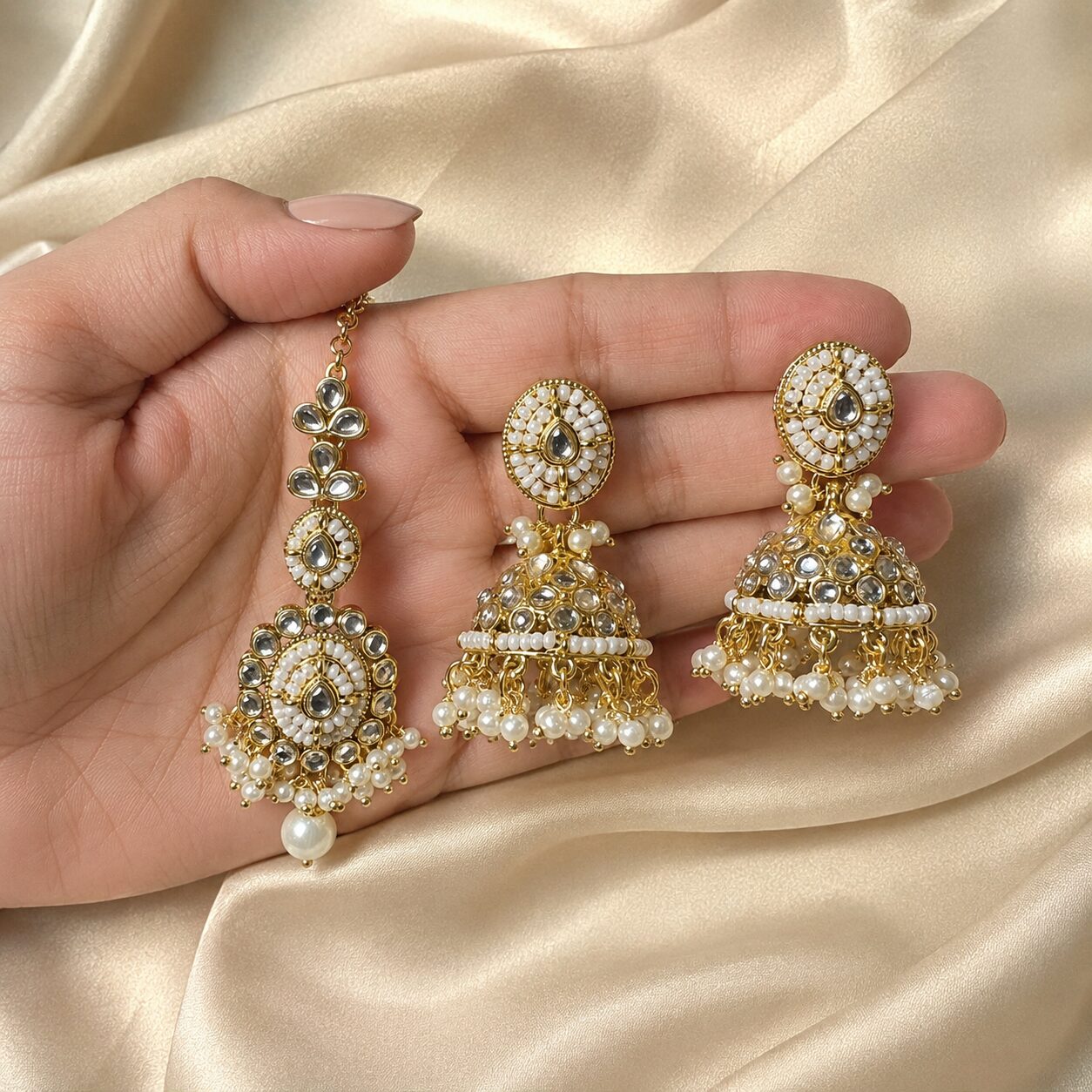 Mahira Pearl Kundan Jhumka Earrings and Teeka Set hand-held view