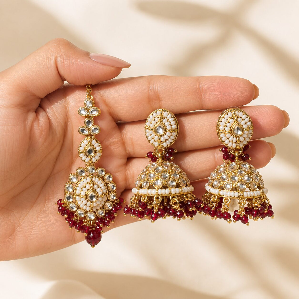 Mahira Ruby Kundan Jhumka Earrings and Teeka Set hand-held view
