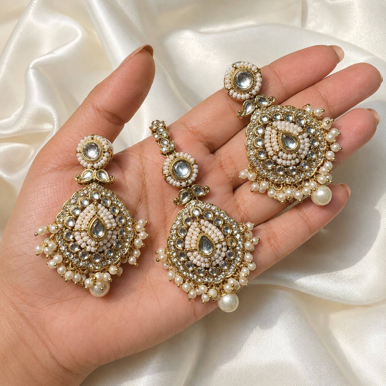 Nureh Pearl Kundan Statement Earrings and Teeka Set hand-held view