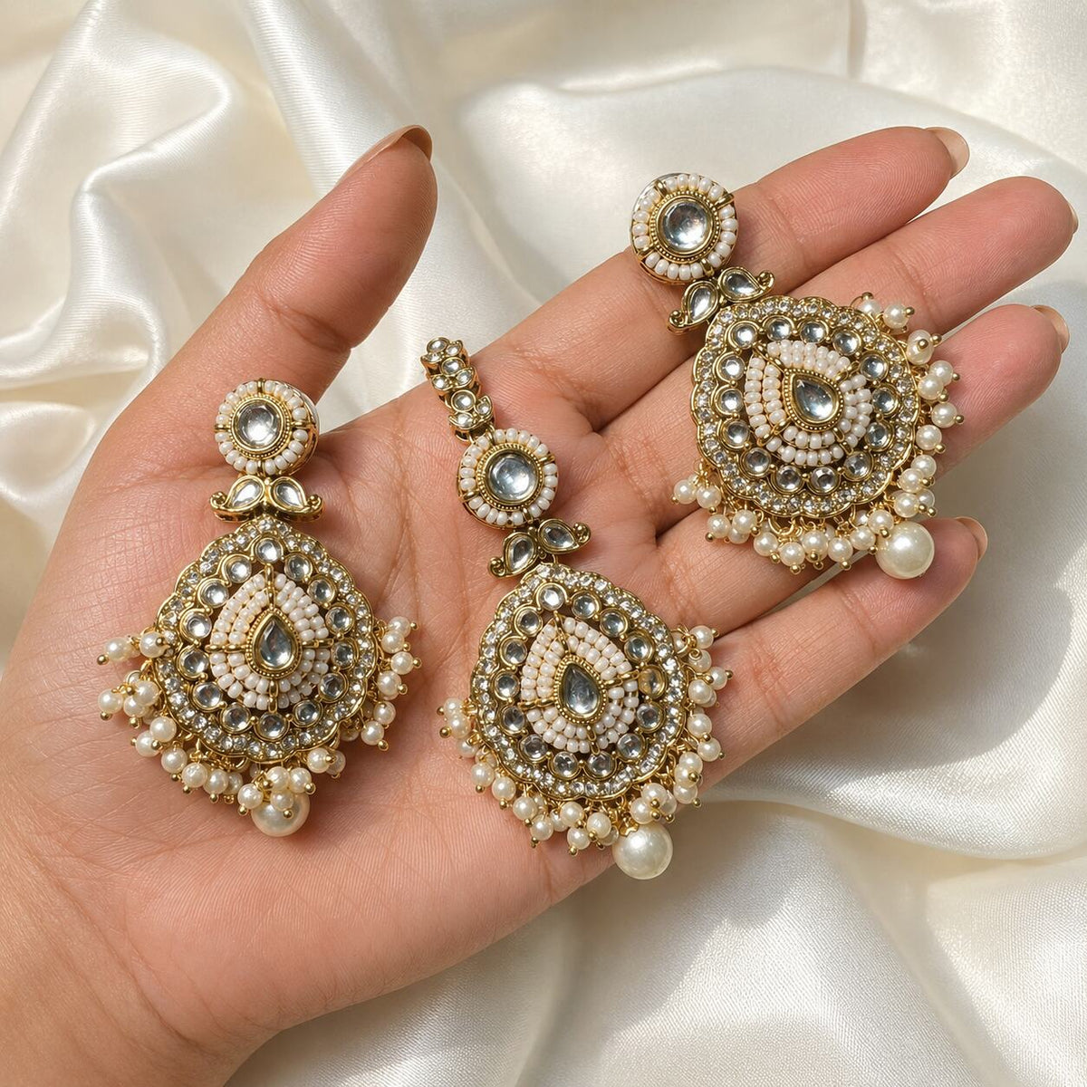Nureh Pearl Kundan Statement Earrings and Teeka Set hand-held view