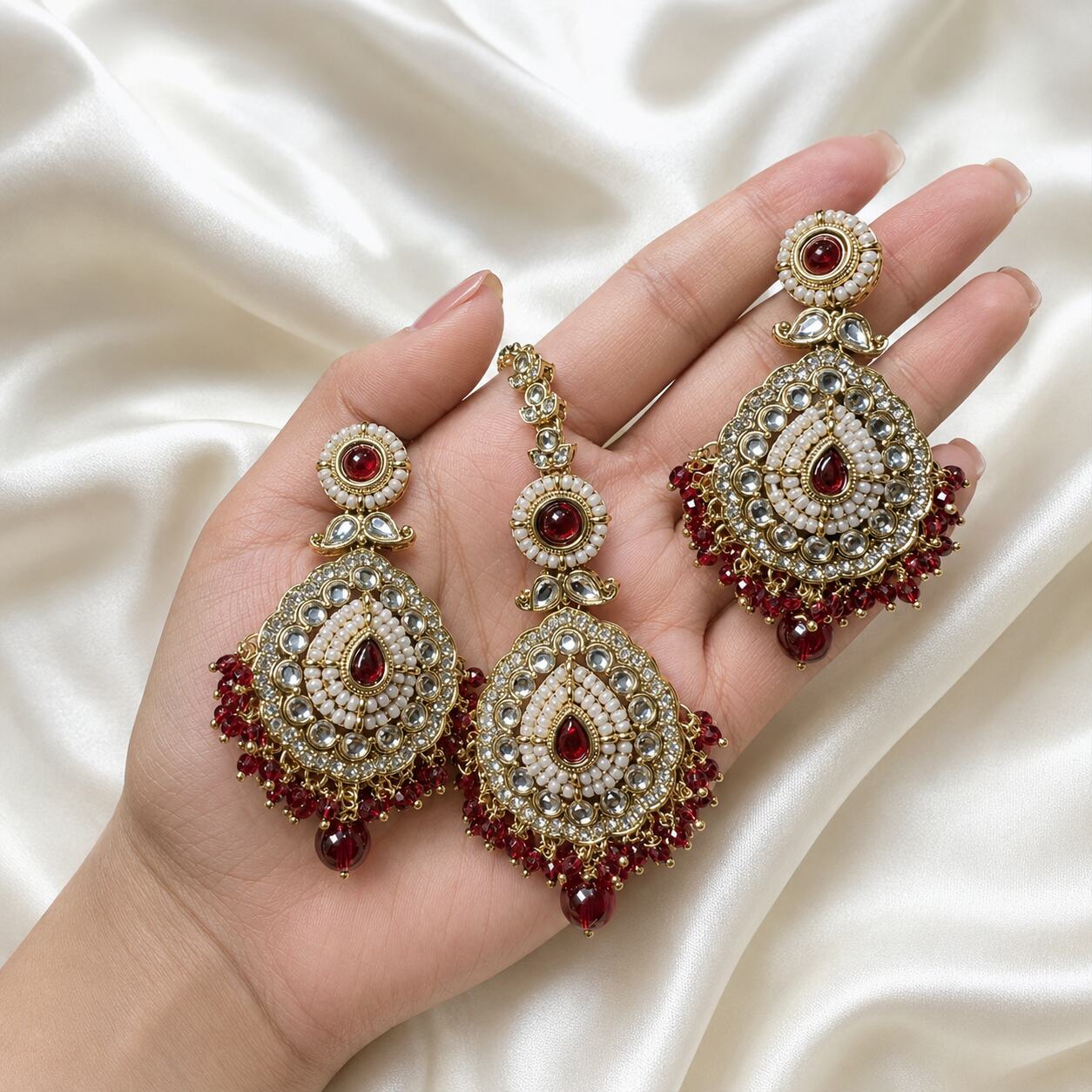 Nureh Red Kundan Statement Earrings and Teeka Set hand-held view