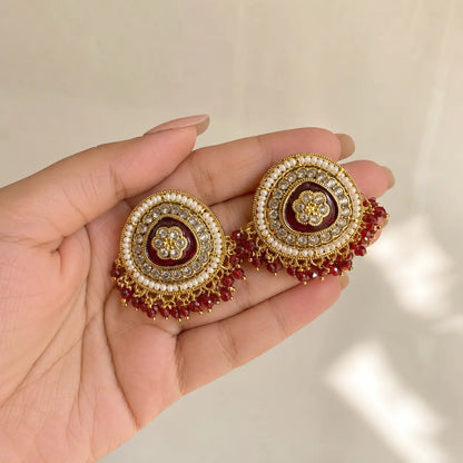 Afsana red earrings handheld scale view